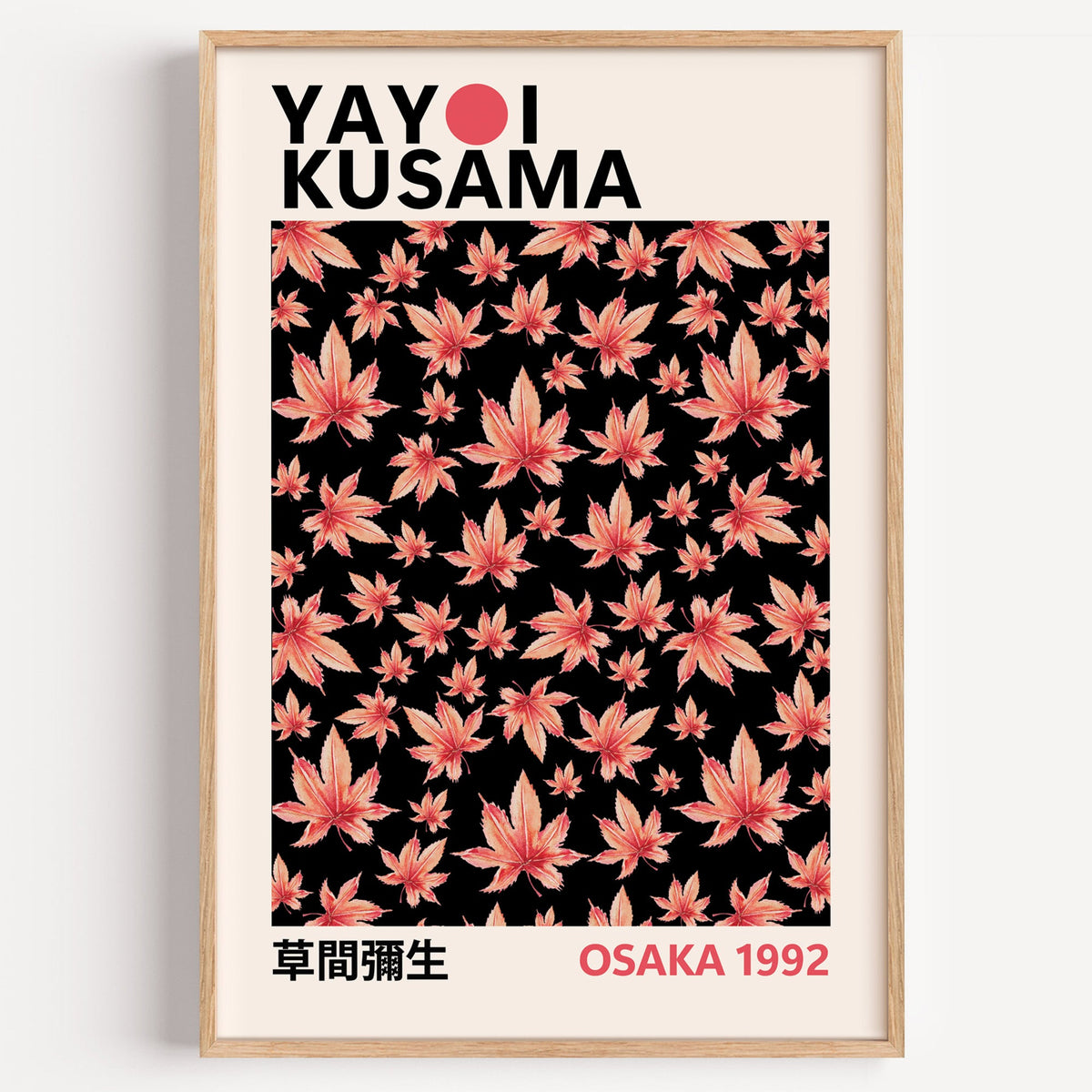 Yayoi Kusama inspired pink maple leaves on black print on a plain white wall