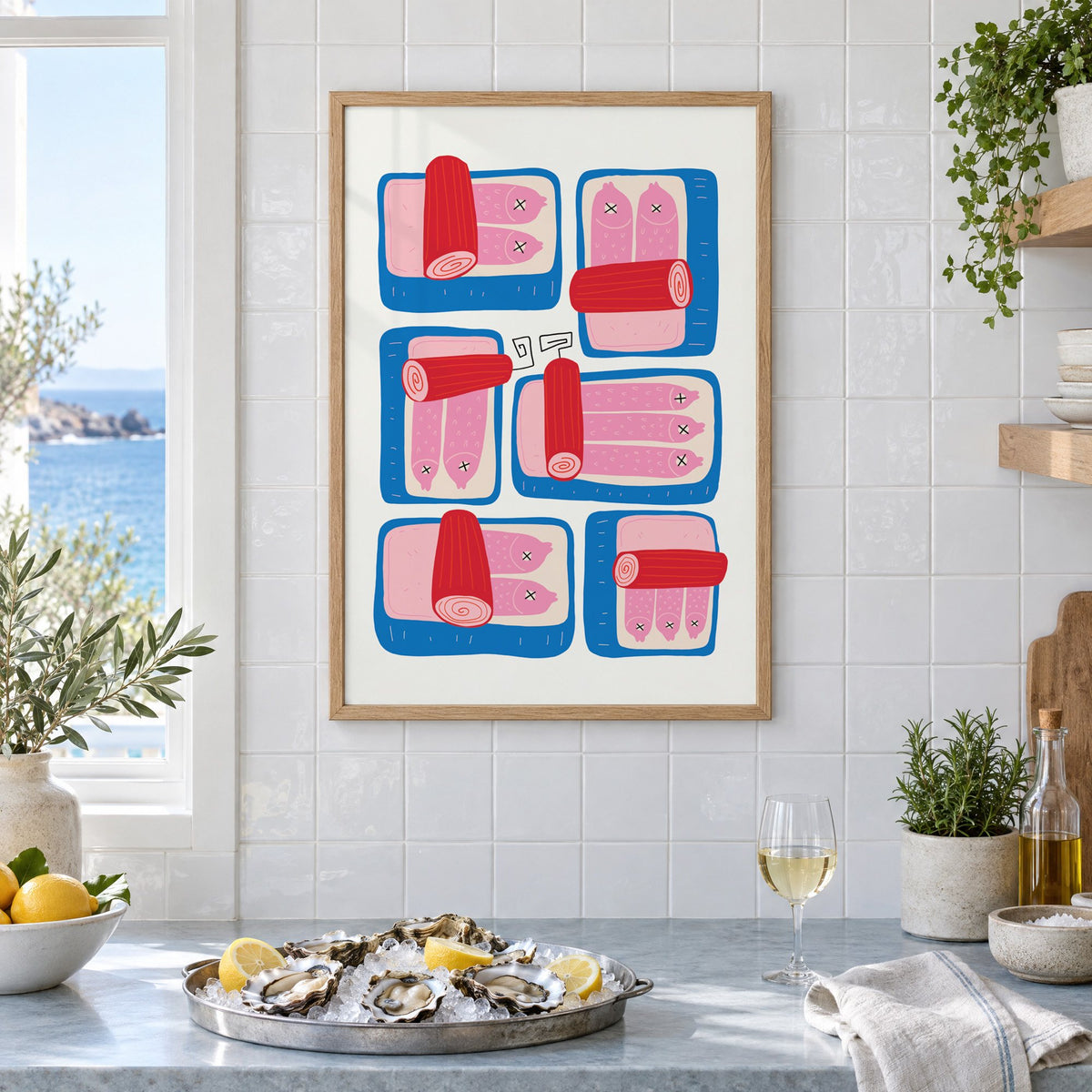 Six blue sardine tins pink fish print in an oak frame on white tiles above a marble counter with oysters and lemons by a sea view