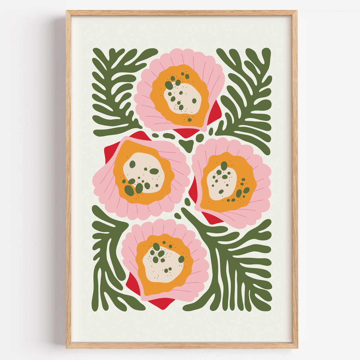 pink scallop shells green seaweed print in a light oak frame on a plain white wall