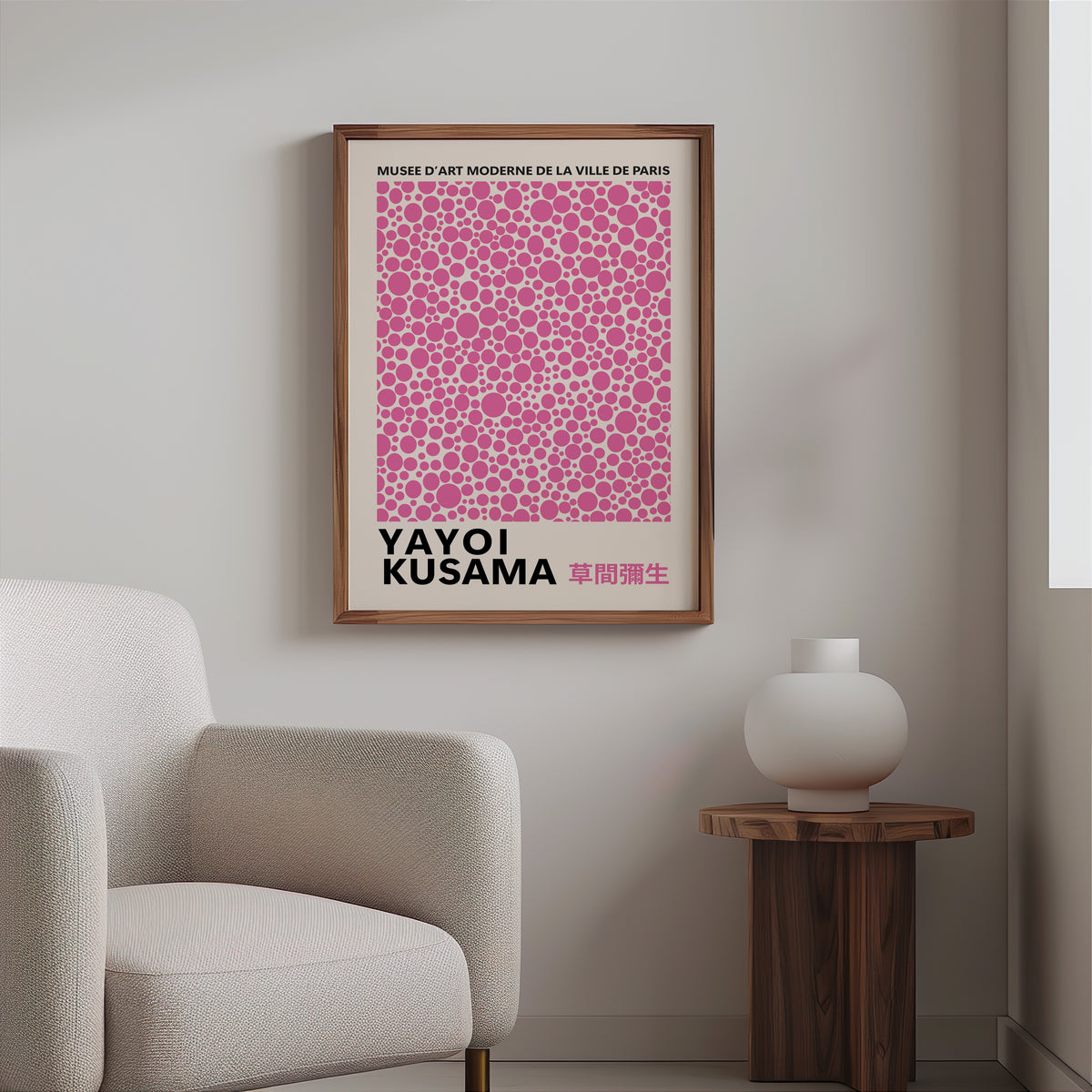 Yayoi Kusama inspired pink polka dot pattern print above a cream boucle armchair