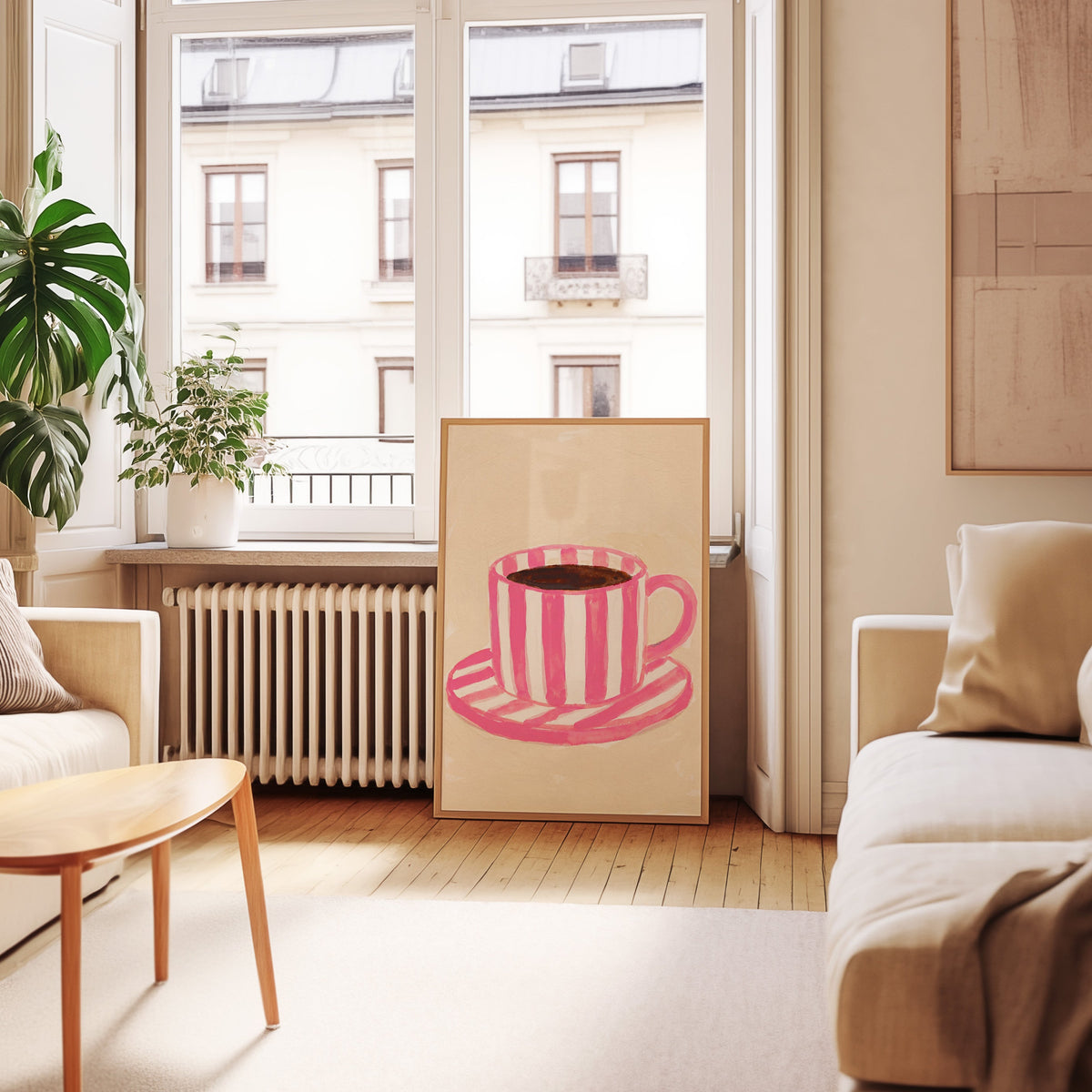 Coffee and saucer print in an oak frame leaning below tall French windows