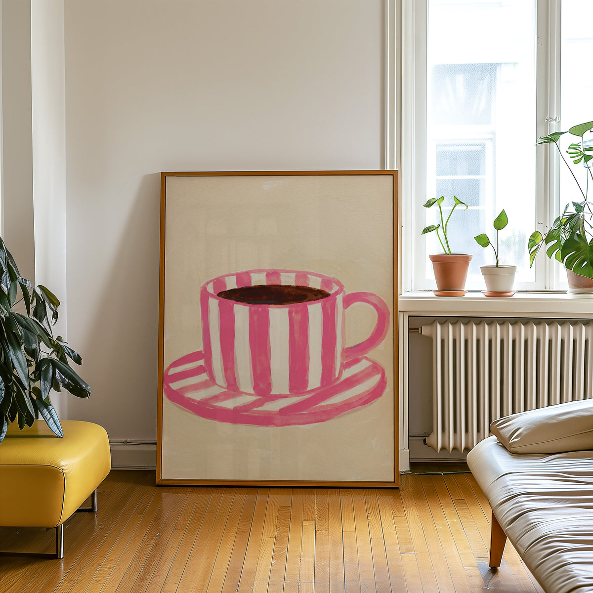 Striped mug kitchen print in an oak frame leaning beside a yellow leather bench