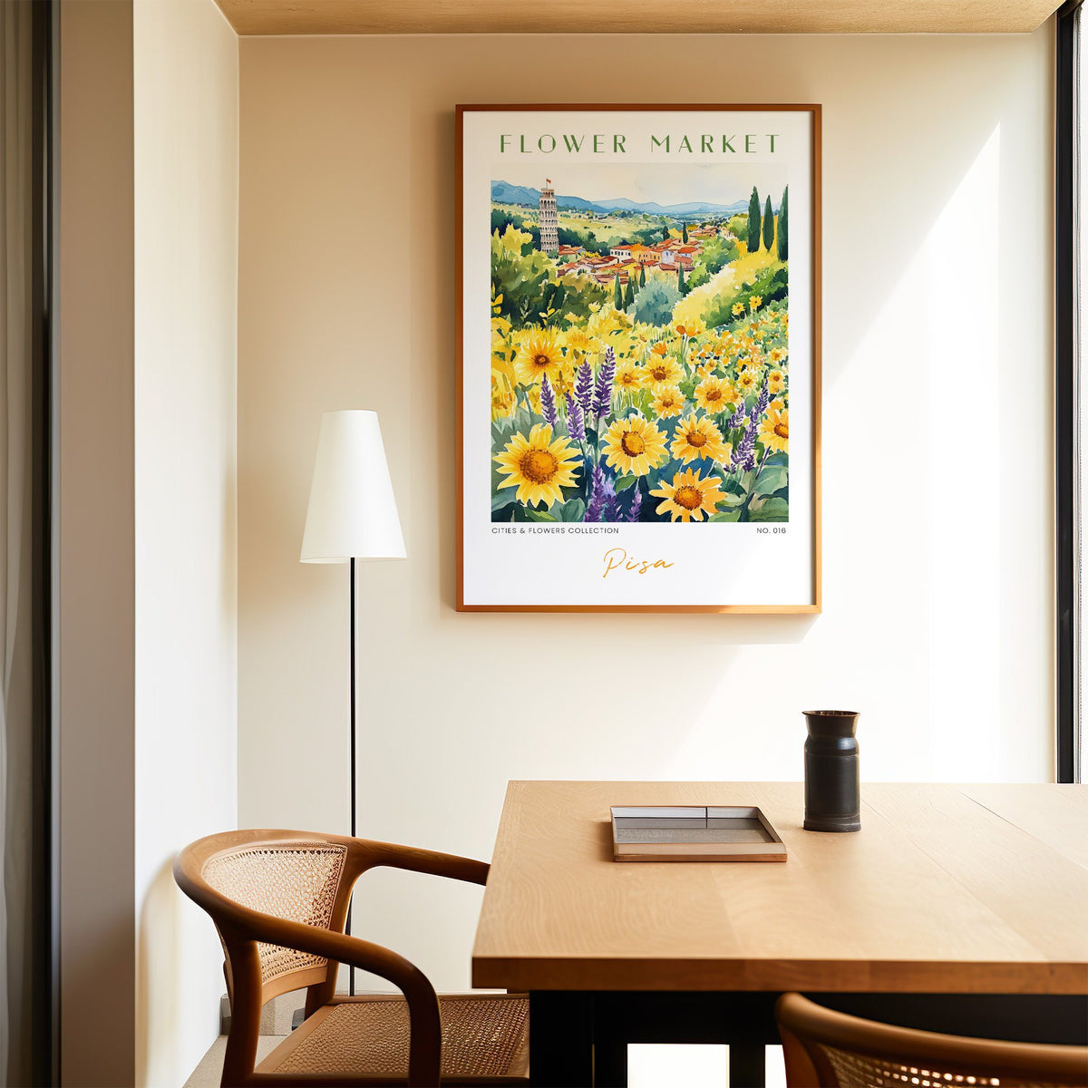 Pisa flower market print in an oak frame above a dining table and cane chair