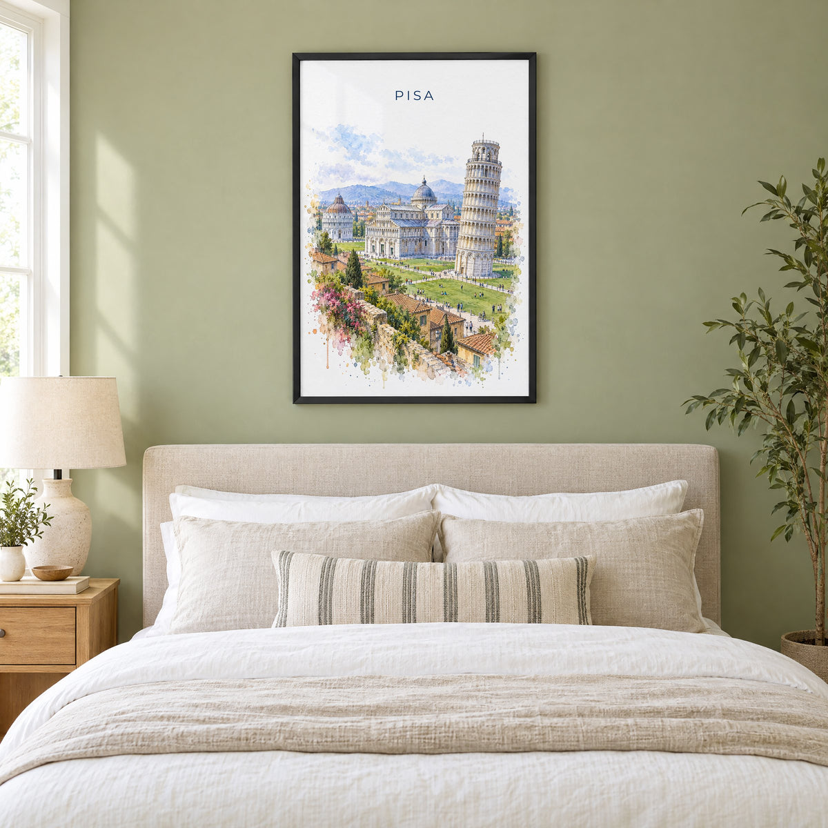 Pisa watercolor print in a black frame above an upholstered headboard in a sage green bedroom