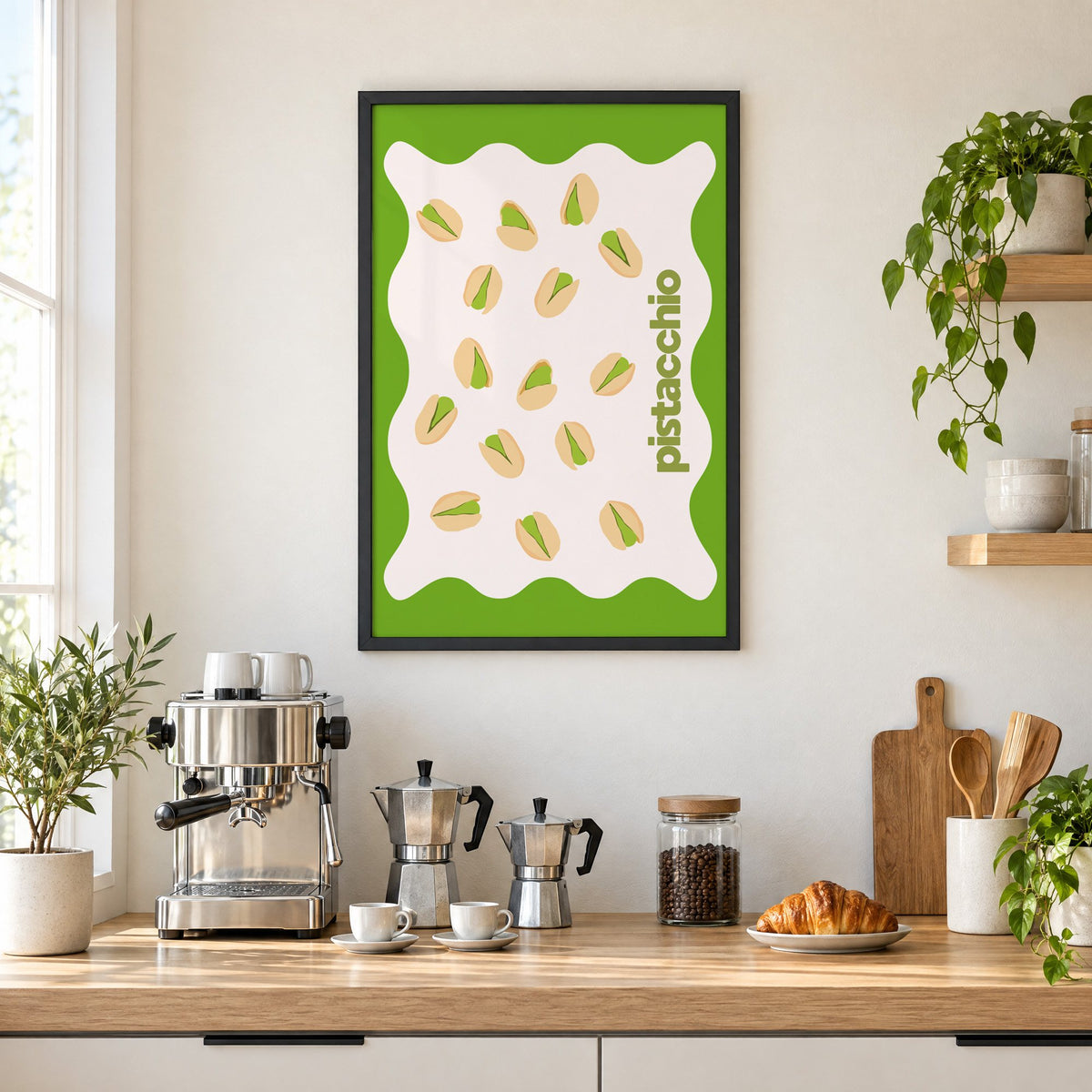 pistacchio vertical type pistachio nuts print in a black frame above a home espresso bar with moka pots and espresso cups