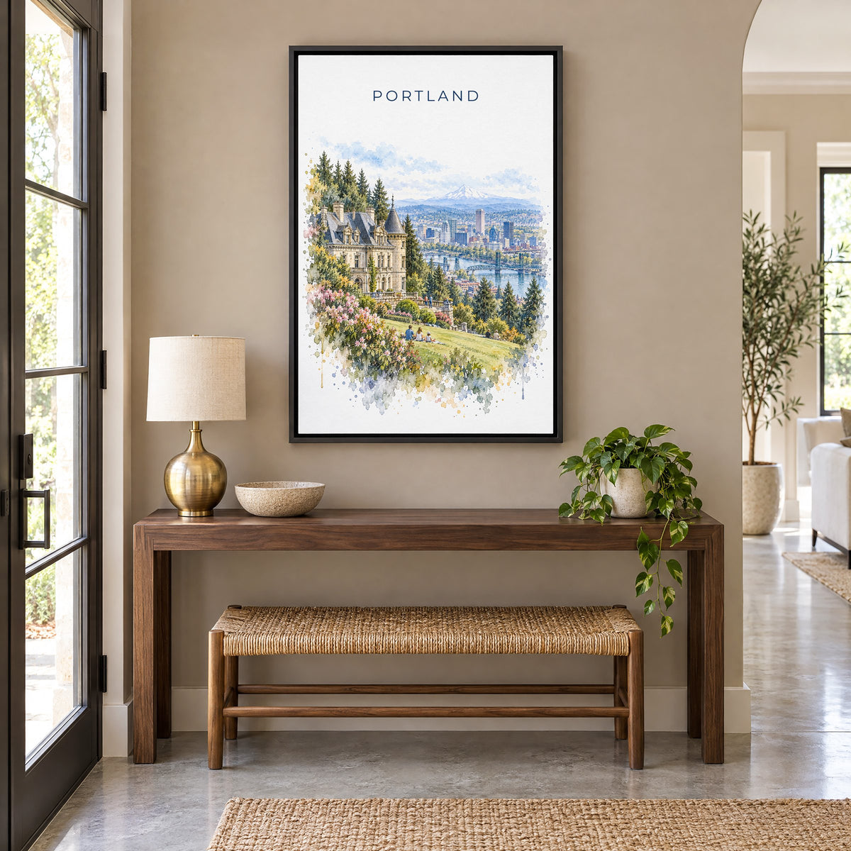 Pittock Mansion Portland watercolor print as a black floater canvas above a walnut console and woven bench in an entryway