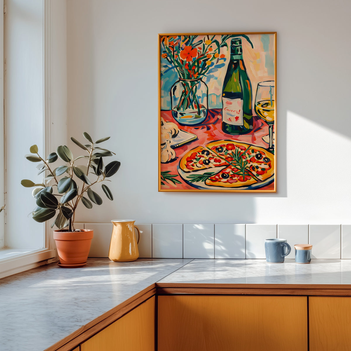 Pizza and champagne print in a gold frame above a marble counter with a yellow jug