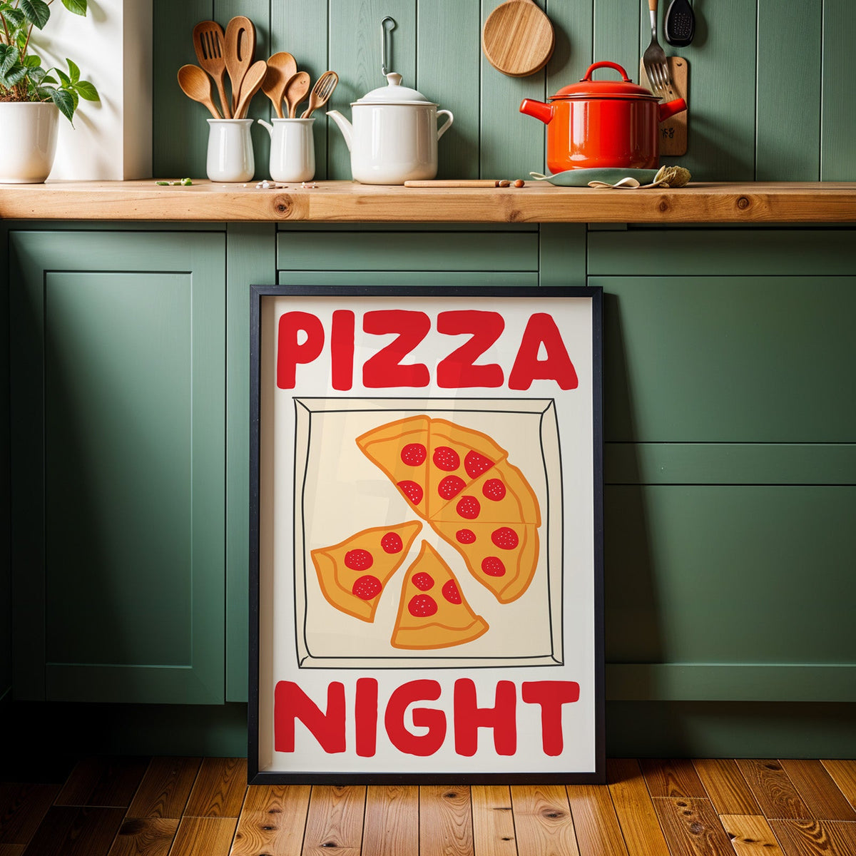 Pizza night pepperoni box print in a black frame against sage green kitchen cabinets