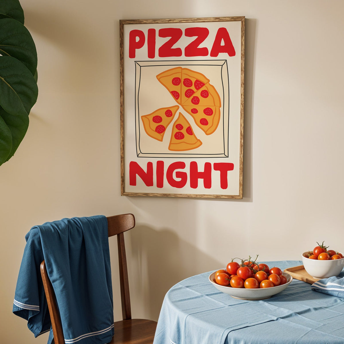 Pizza night pepperoni box print in an oak frame above a blue linen table with tomatoes