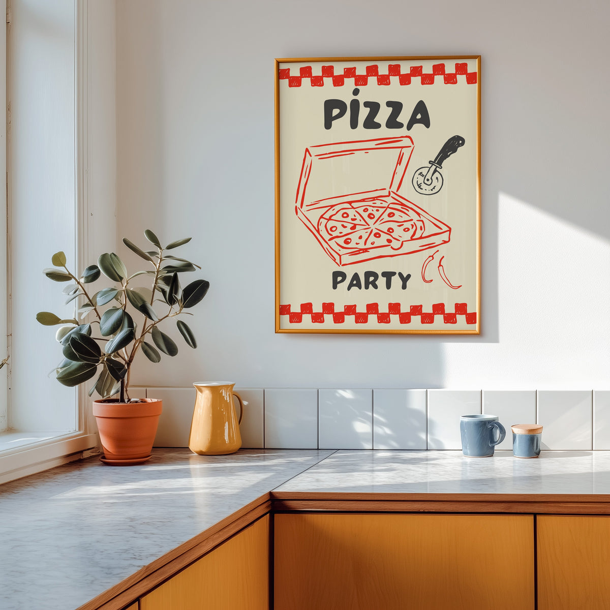 Pizza Party print in a gold frame above a marble counter with a yellow ceramic jug