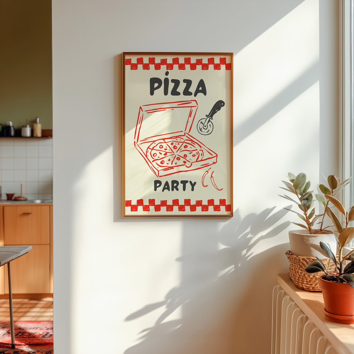 Pizza Party print in a gold frame in sunlight with plants and a kitchen beyond