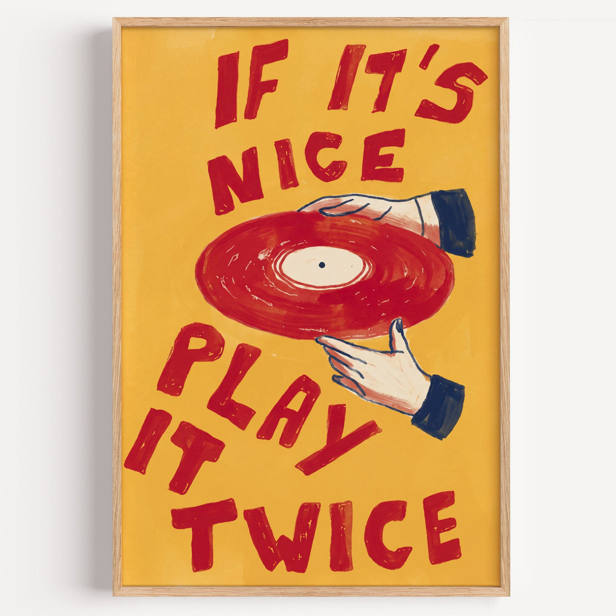 If It's Nice Play It Twice print in a light oak frame on a plain white wall