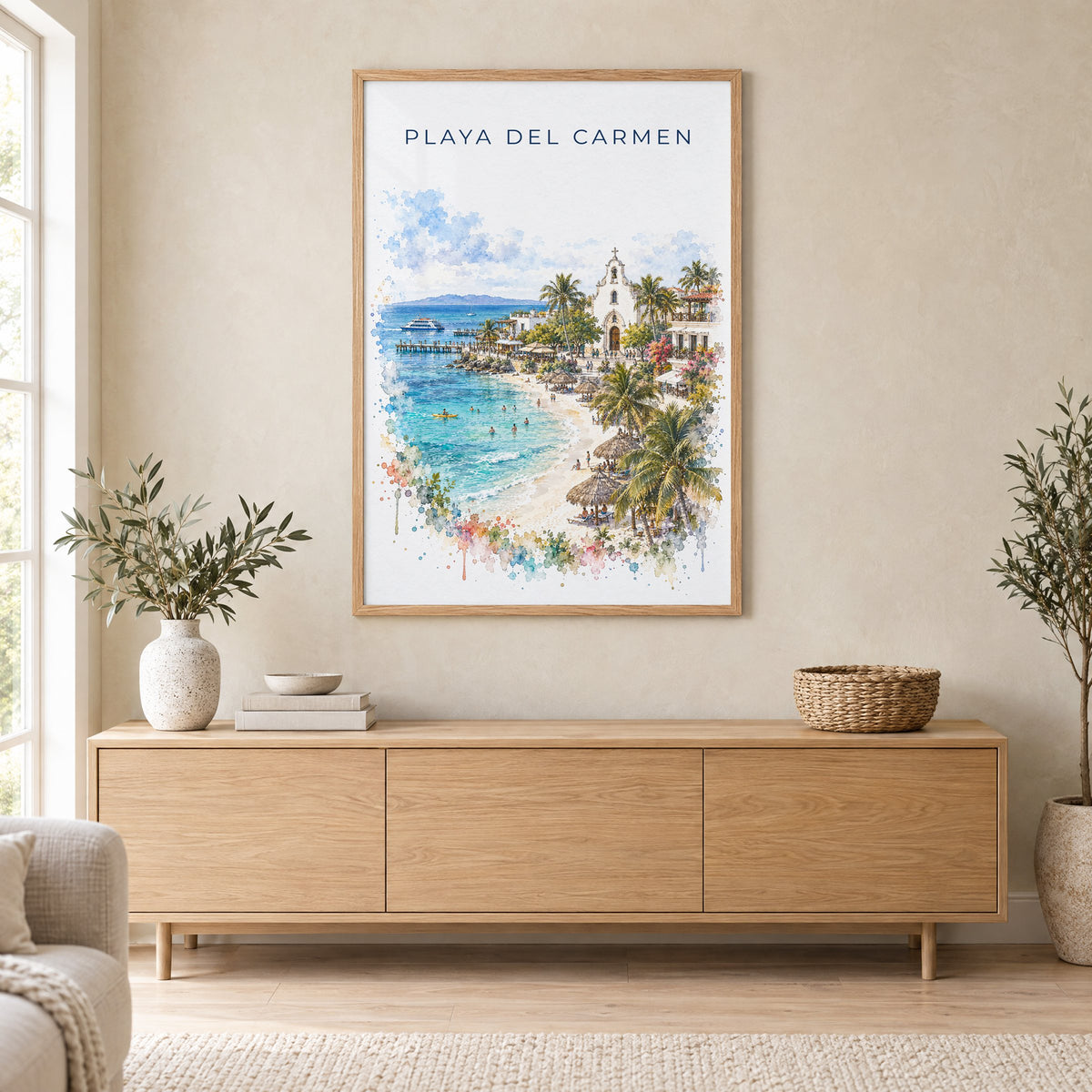 Playa del Carmen watercolor print in an oak frame above a light wood sideboard in a Scandinavian living room