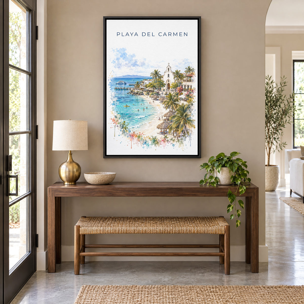 Playa del Carmen watercolor print as a black floater canvas above a walnut console and woven bench in an entryway