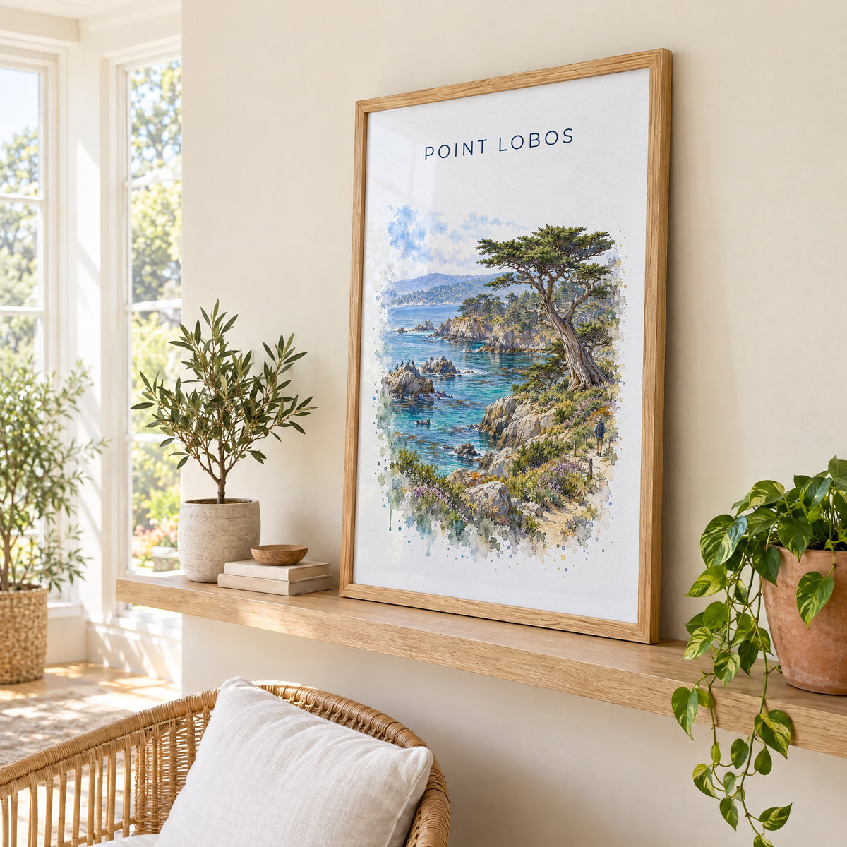 Point Lobos State Natural Reserve watercolor print in an oak frame on a picture ledge in a sunlit sunroom