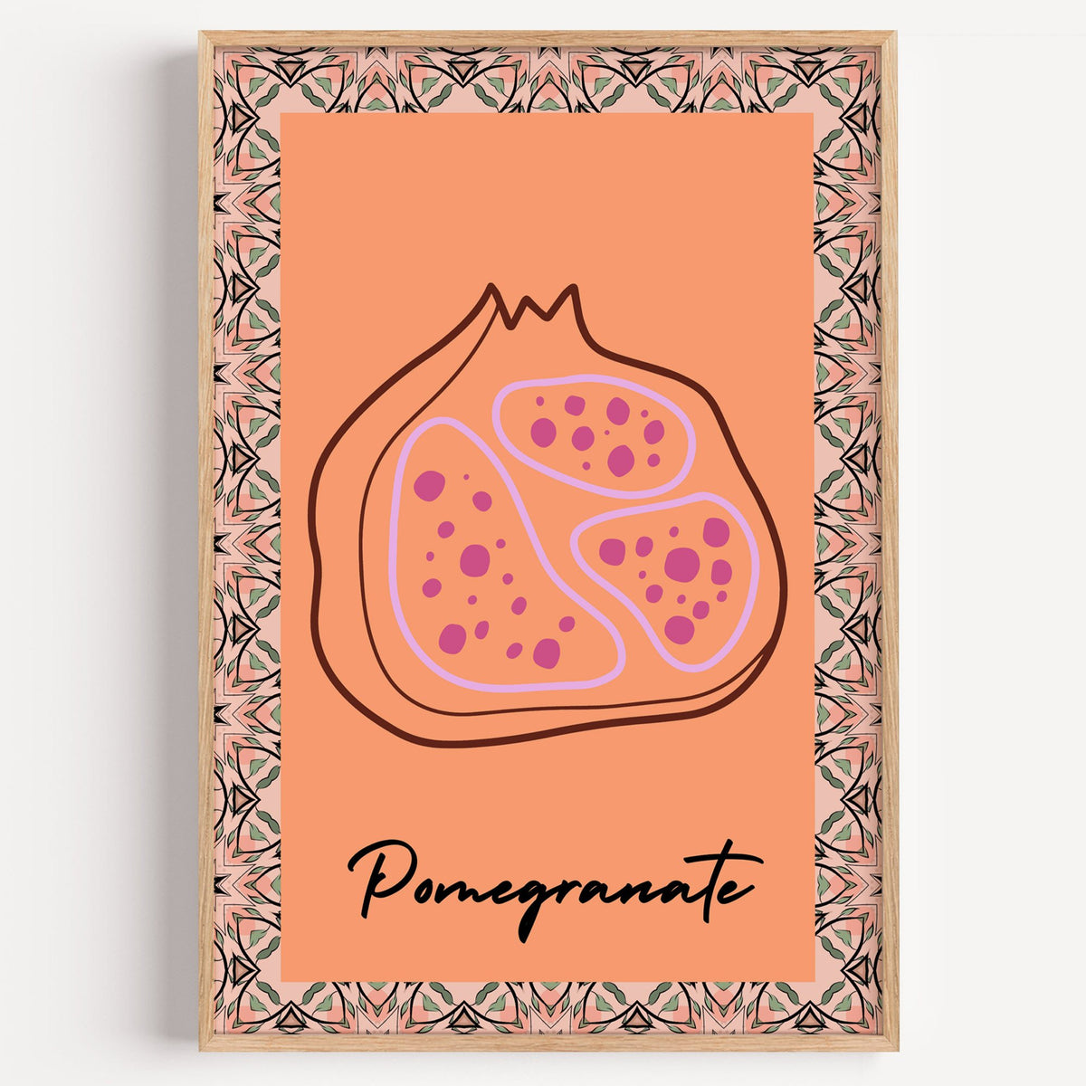 Pomegranate line-art kaleidoscope border print in a light oak frame on a plain white wall