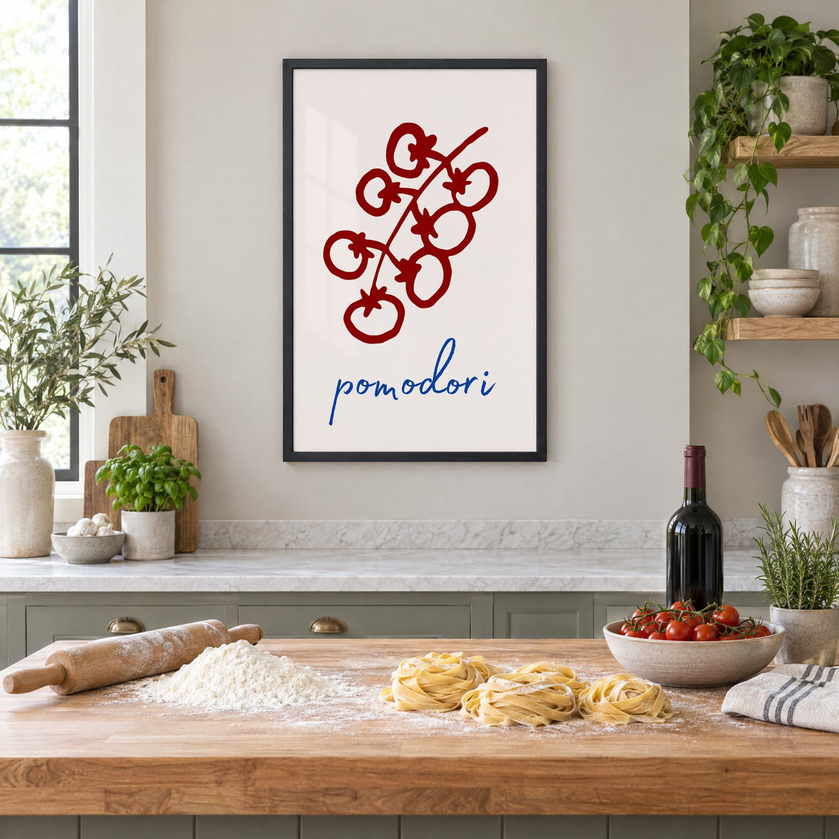 pomodori red cherry tomato vine print in a black frame above a butcher-block island with fresh pasta, flour and cherry tomatoes