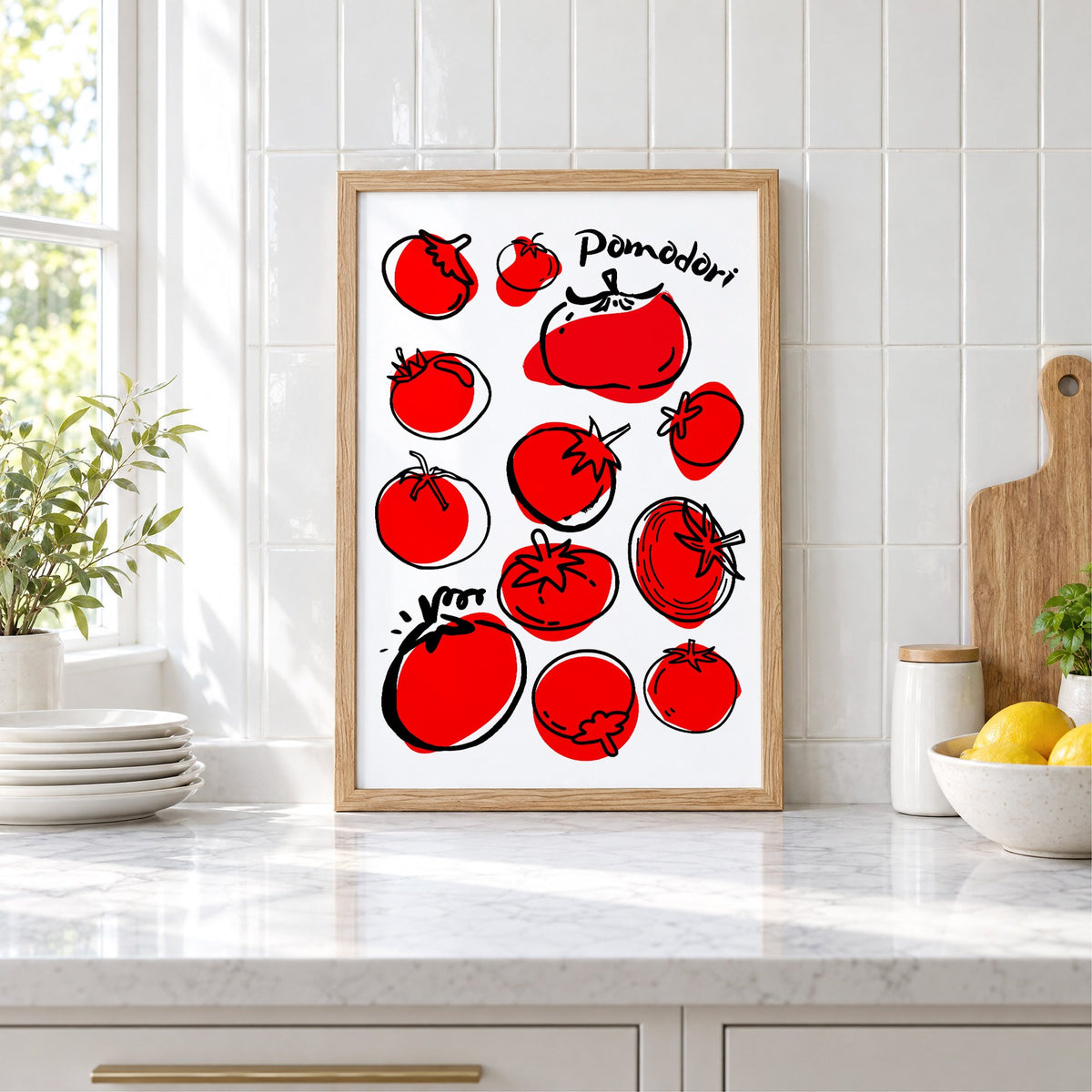 Pomodori tomatoes ink sketch print in an oak frame leaning on a marble counter by white tiles and lemons