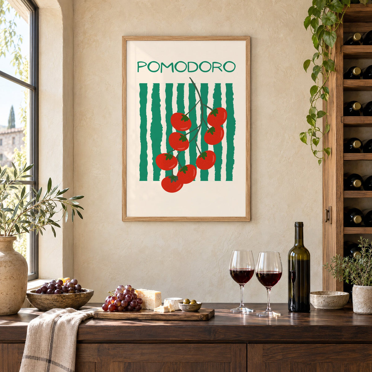 POMODORO cherry tomato vine striped print in an oak frame on a limewashed wall above a wine counter with red wine, cheese and grapes