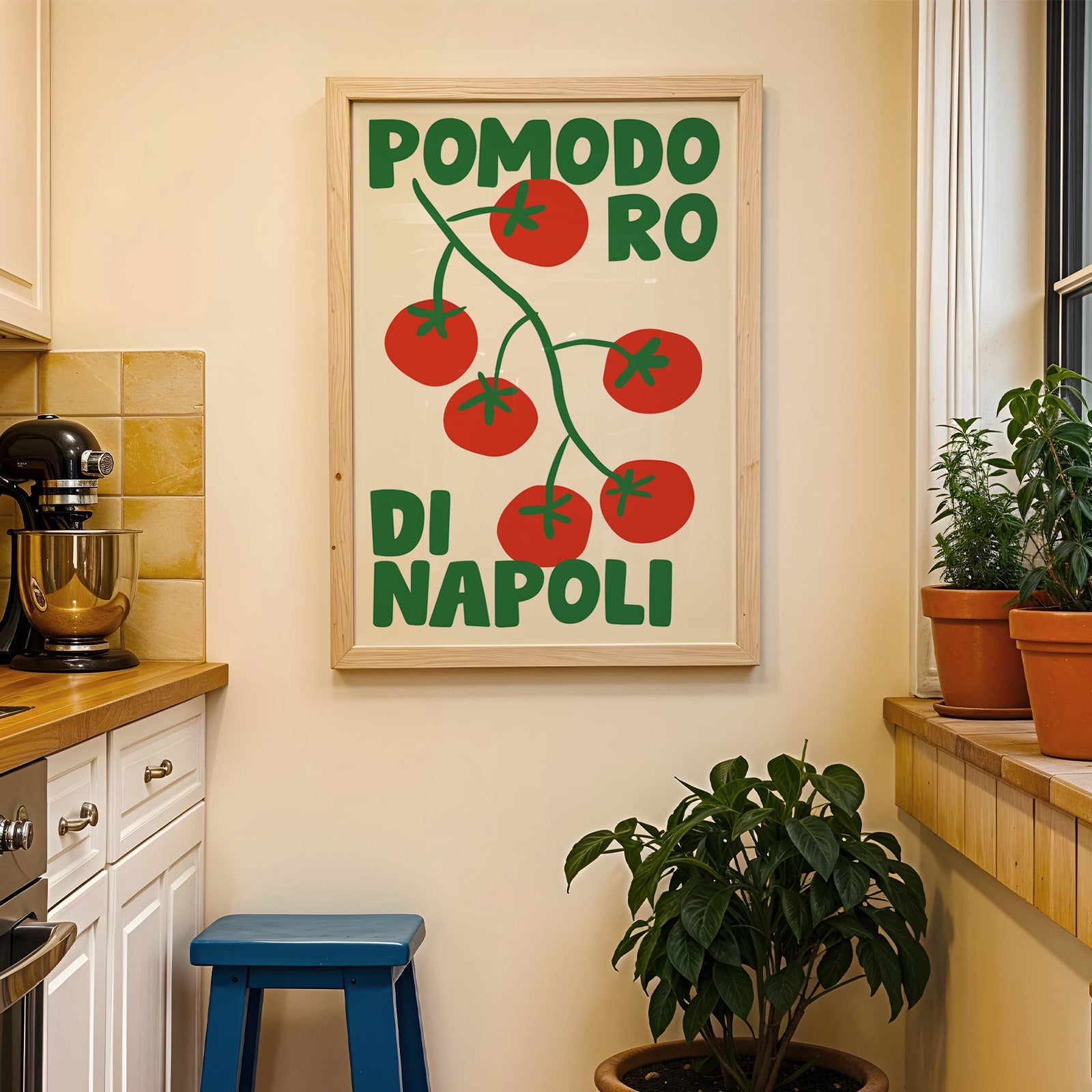 Pomodoro di Napoli tomato print in a wood frame on a yellow tiled kitchen wall