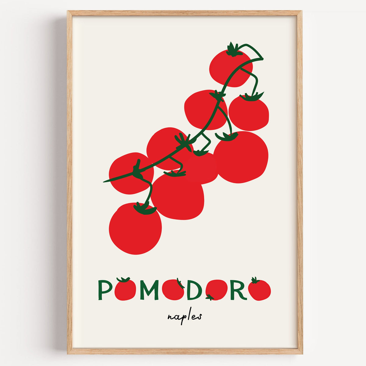 Pomodoro Naples tomato vine print in a light oak frame on a plain white wall