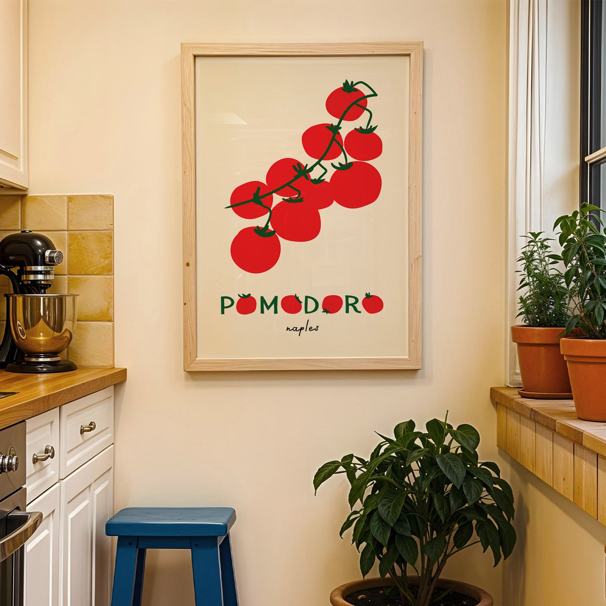 Pomodoro Naples tomato vine print in a wood frame on a yellow tiled kitchen wall