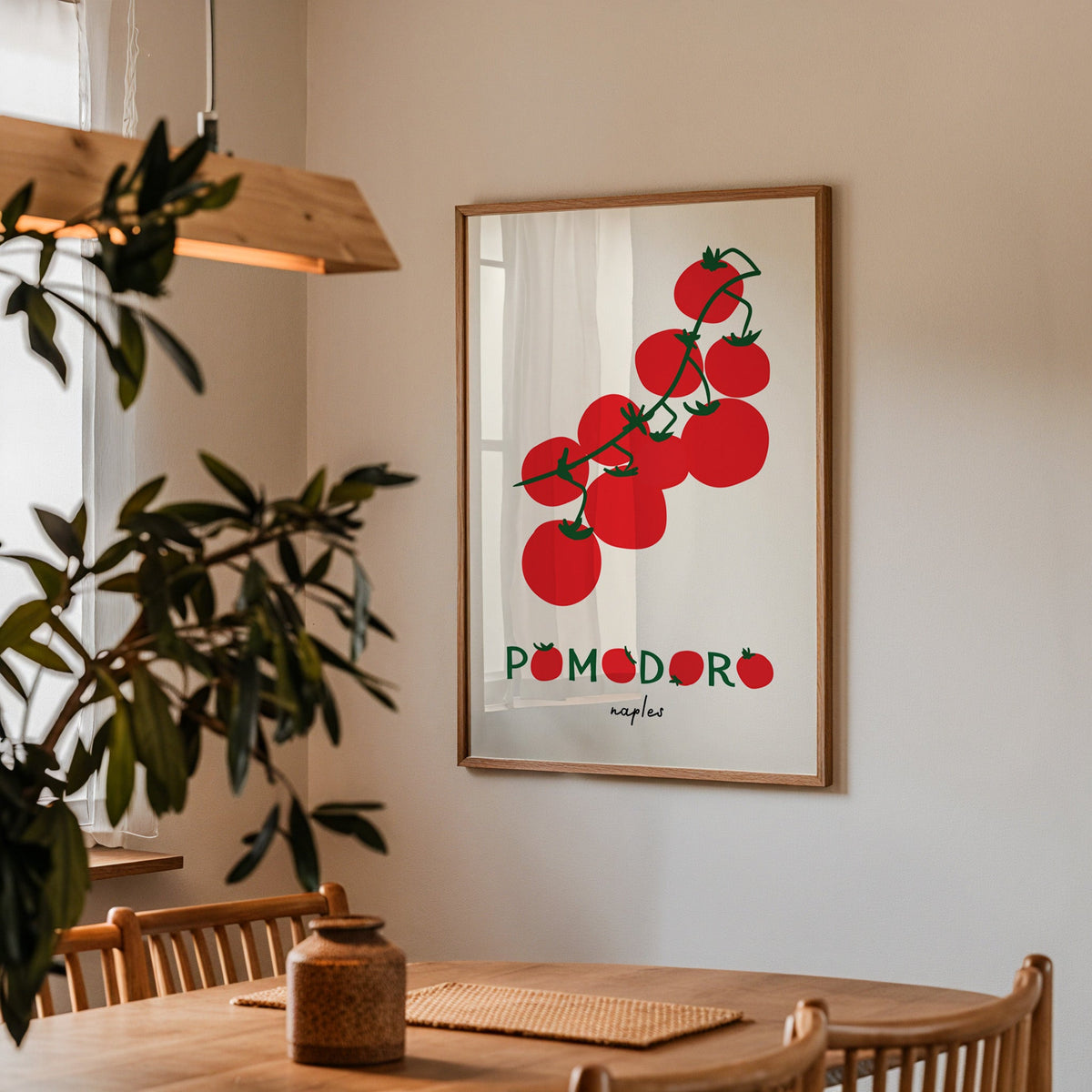 Pomodoro Naples tomato vine print in a walnut frame above a table beside an olive tree