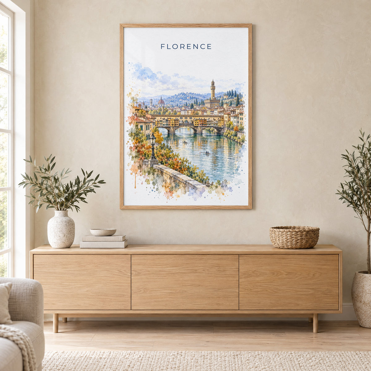 Ponte Vecchio watercolor print in an oak frame above a light wood sideboard in a Scandinavian living room