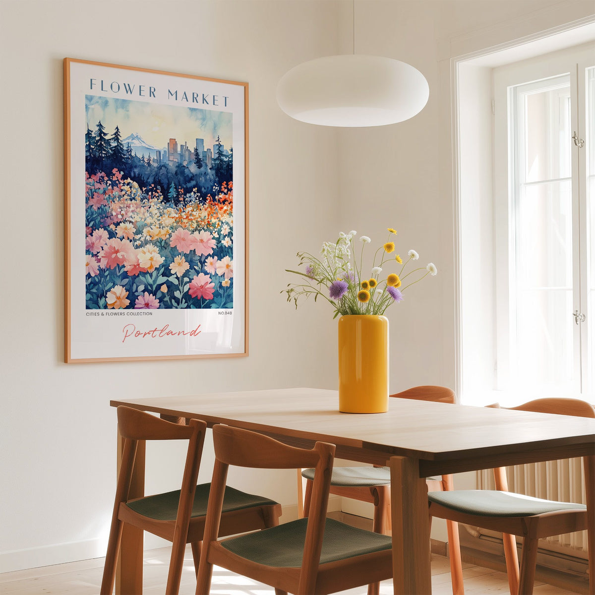 Portland flower market print in an oak frame above a dining table with a yellow vase and white pendant light