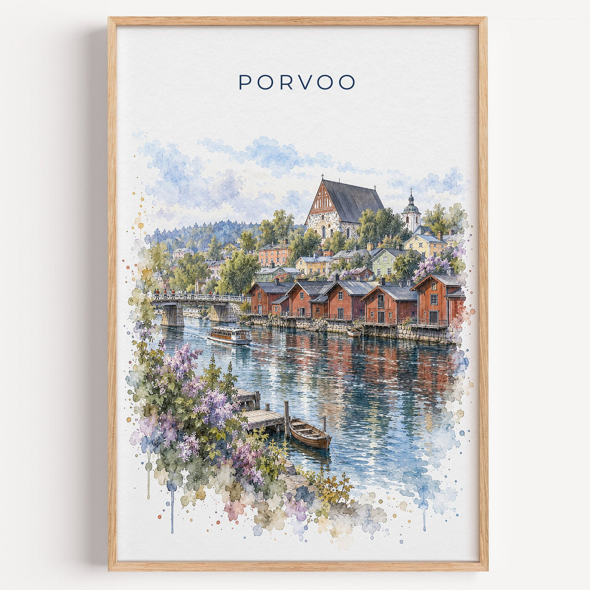 Porvoo watercolor print in a light oak frame on a plain white wall
