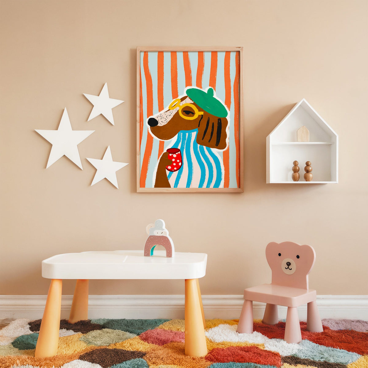 Posh dog in green beret nursery print in an oak frame on a peach wall above a kids table with wall stars