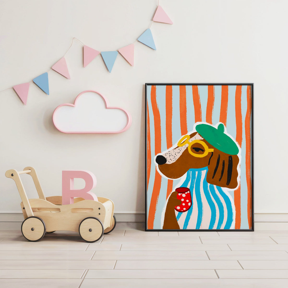 Posh dog in green beret nursery print in a black frame under pastel bunting by a wooden baby walker