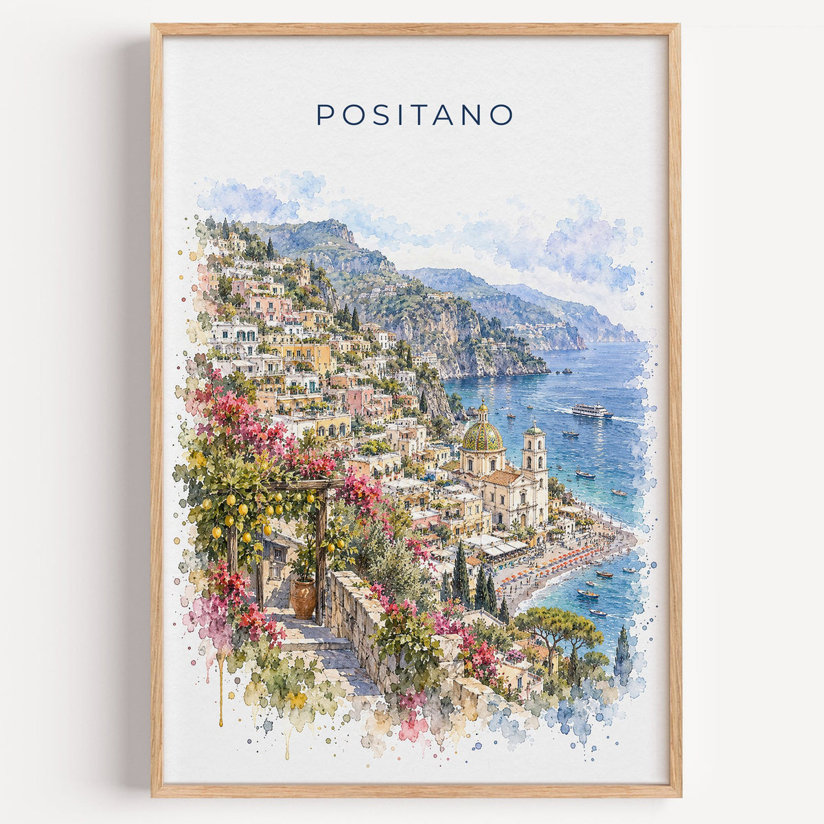Positano watercolor print in a light oak frame on a plain white wall