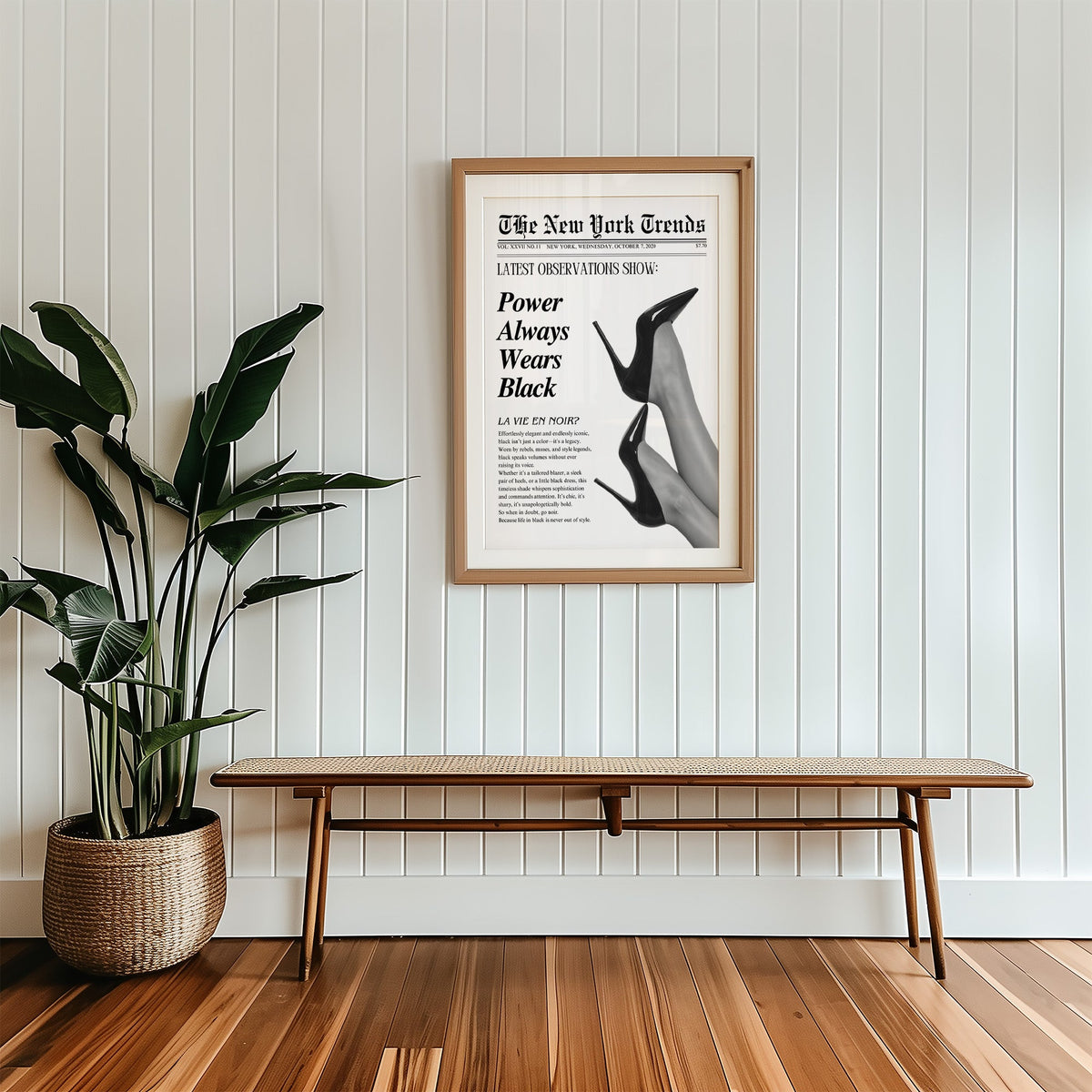 Two pairs of black heels mock newspaper print in a wood frame with a white mat above a cane bench