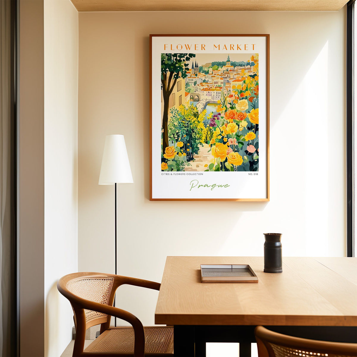 Prague flower market print in an oak frame above a dining table and cane chair