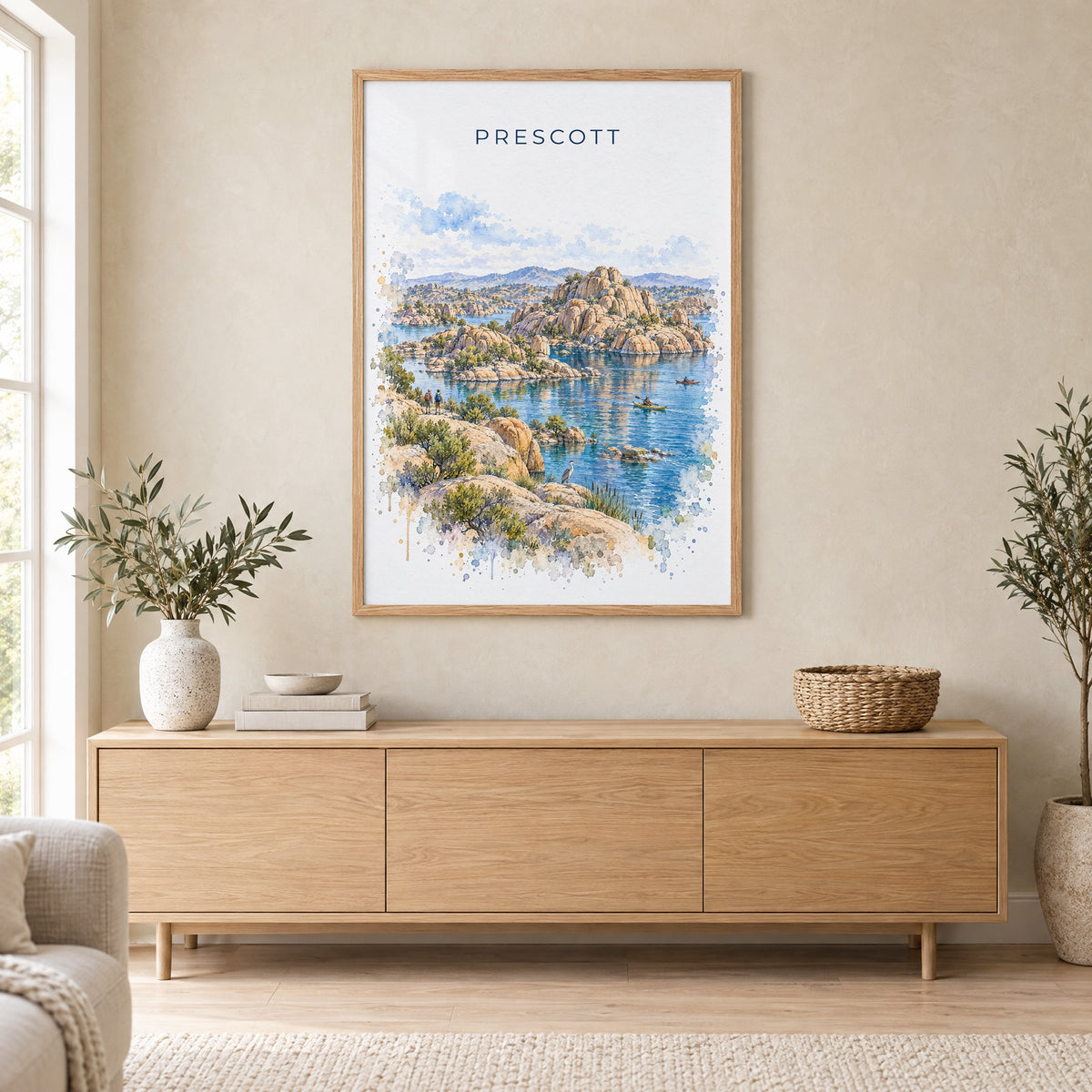 Prescott watercolor print in an oak frame above a light wood sideboard in a Scandinavian living room