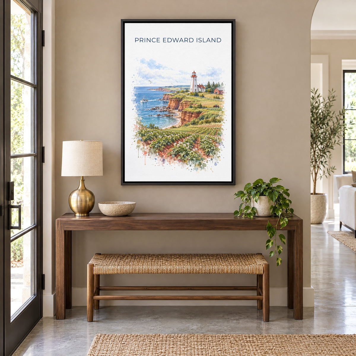 Prince Edward Island watercolor print as a black floater canvas above a walnut console and woven bench in an entryway