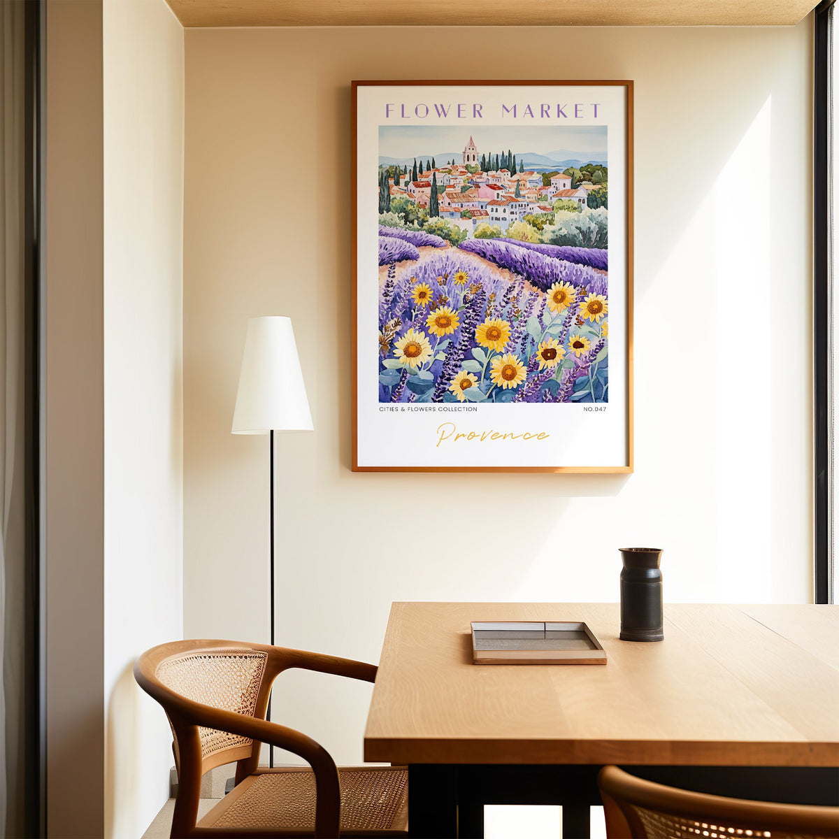 Provence flower market print in an oak frame above a dining table and cane chair