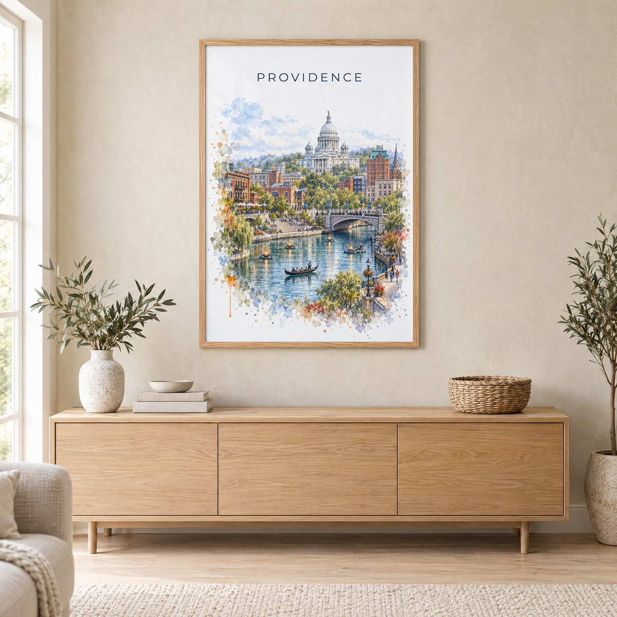 Providence watercolor print in an oak frame above a light wood sideboard in a Scandinavian living room