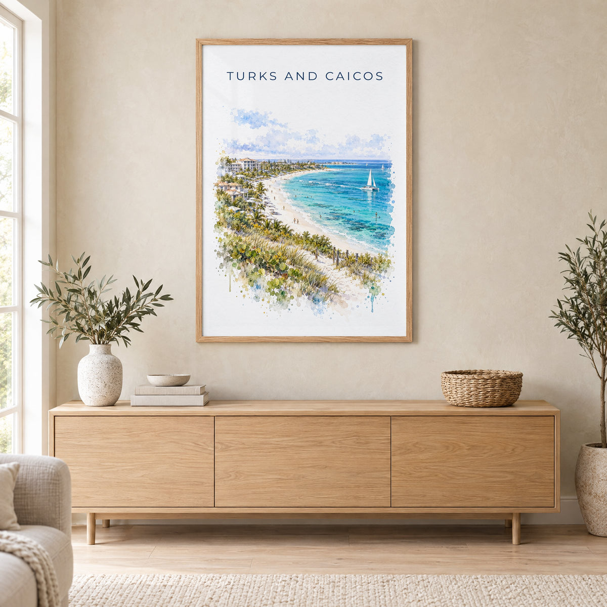 Turks and Caicos watercolor print in an oak frame above a light wood sideboard in a Scandinavian living room
