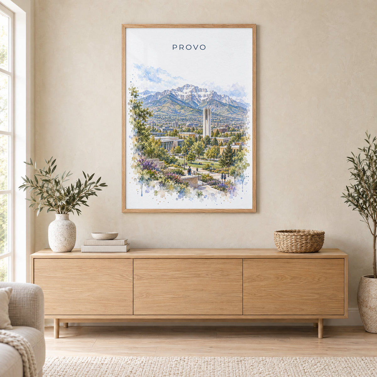 Provo watercolor print in an oak frame above a light wood sideboard in a Scandinavian living room