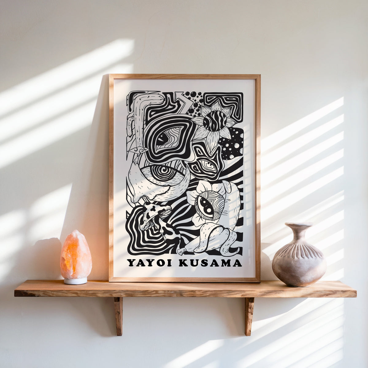 Yayoi Kusama inspired psychedelic eyes and mushroom print in an oak frame on a live edge shelf beside a salt lamp