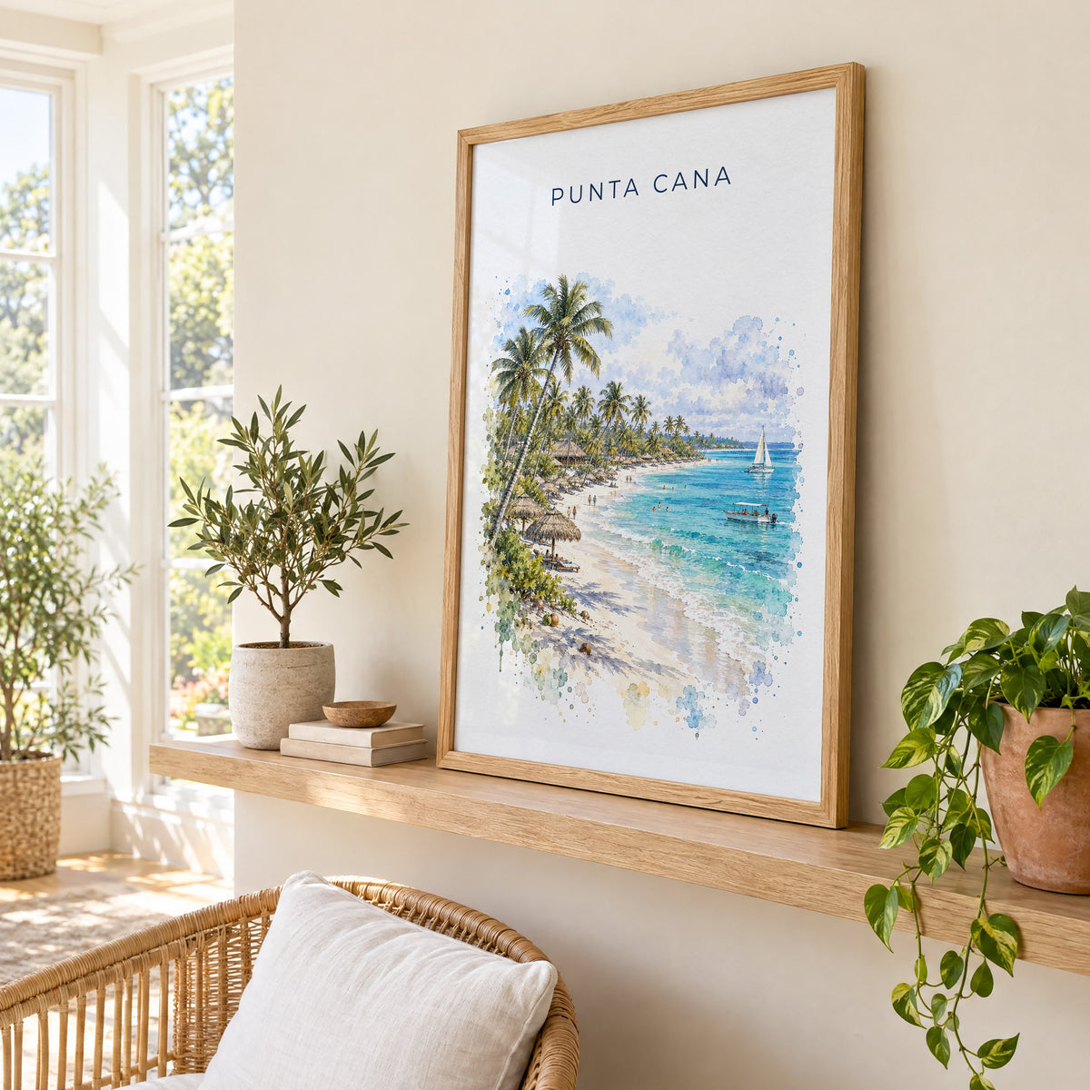 Punta Cana watercolor print in an oak frame on a picture ledge in a sunlit sunroom