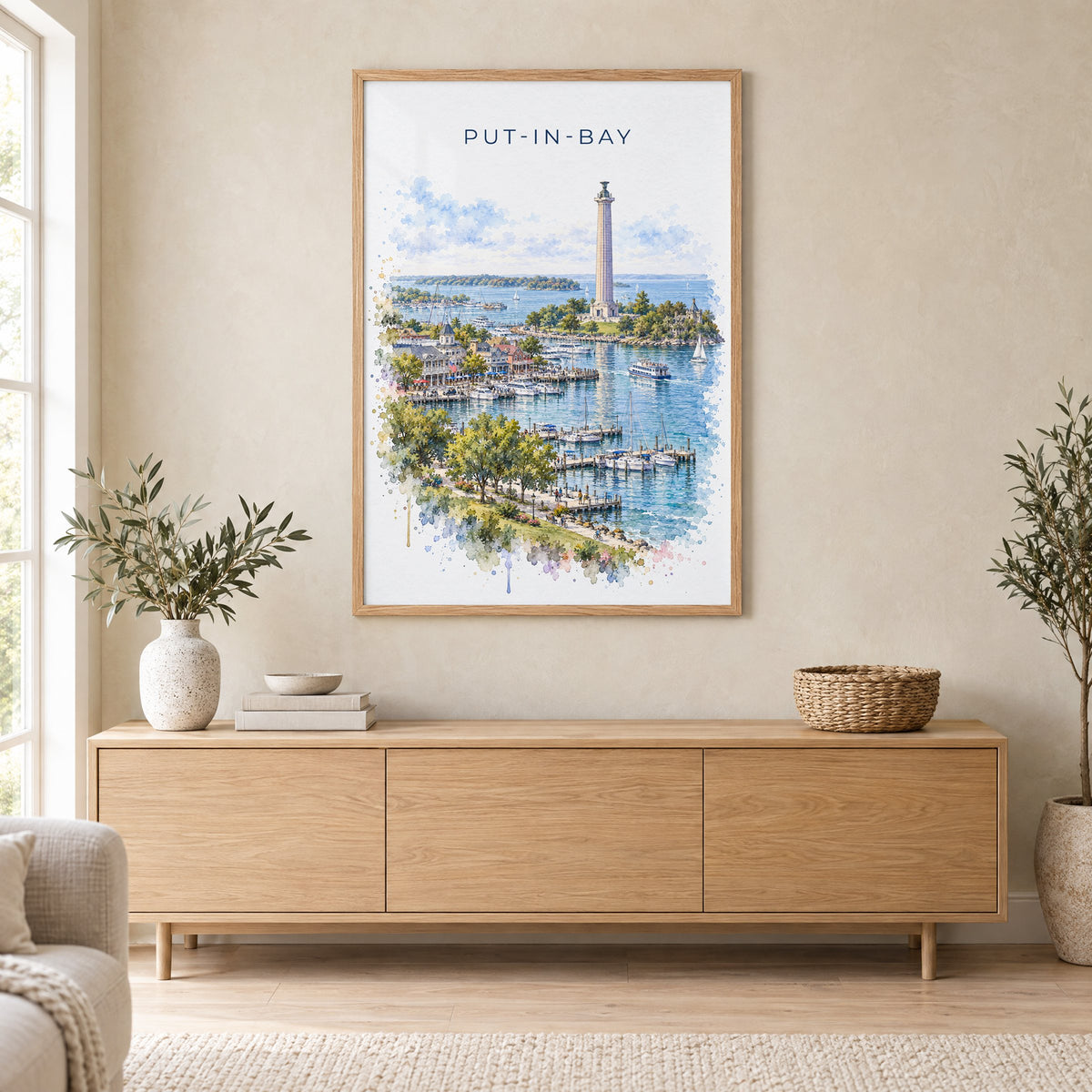 Put-in-Bay watercolor print in an oak frame above a light wood sideboard in a Scandinavian living room