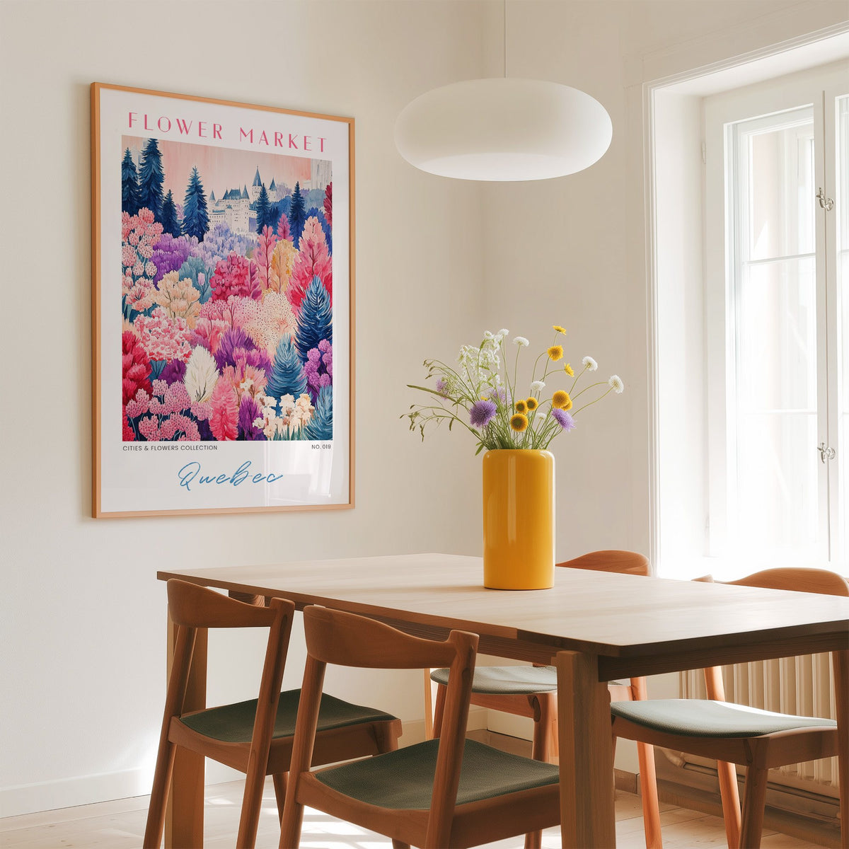 Quebec flower market print in an oak frame above a dining table with a yellow vase and white pendant light