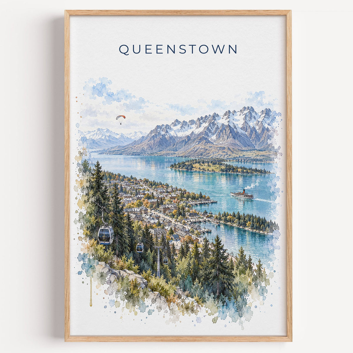 Queenstown watercolor print in a light oak frame on a plain white wall
