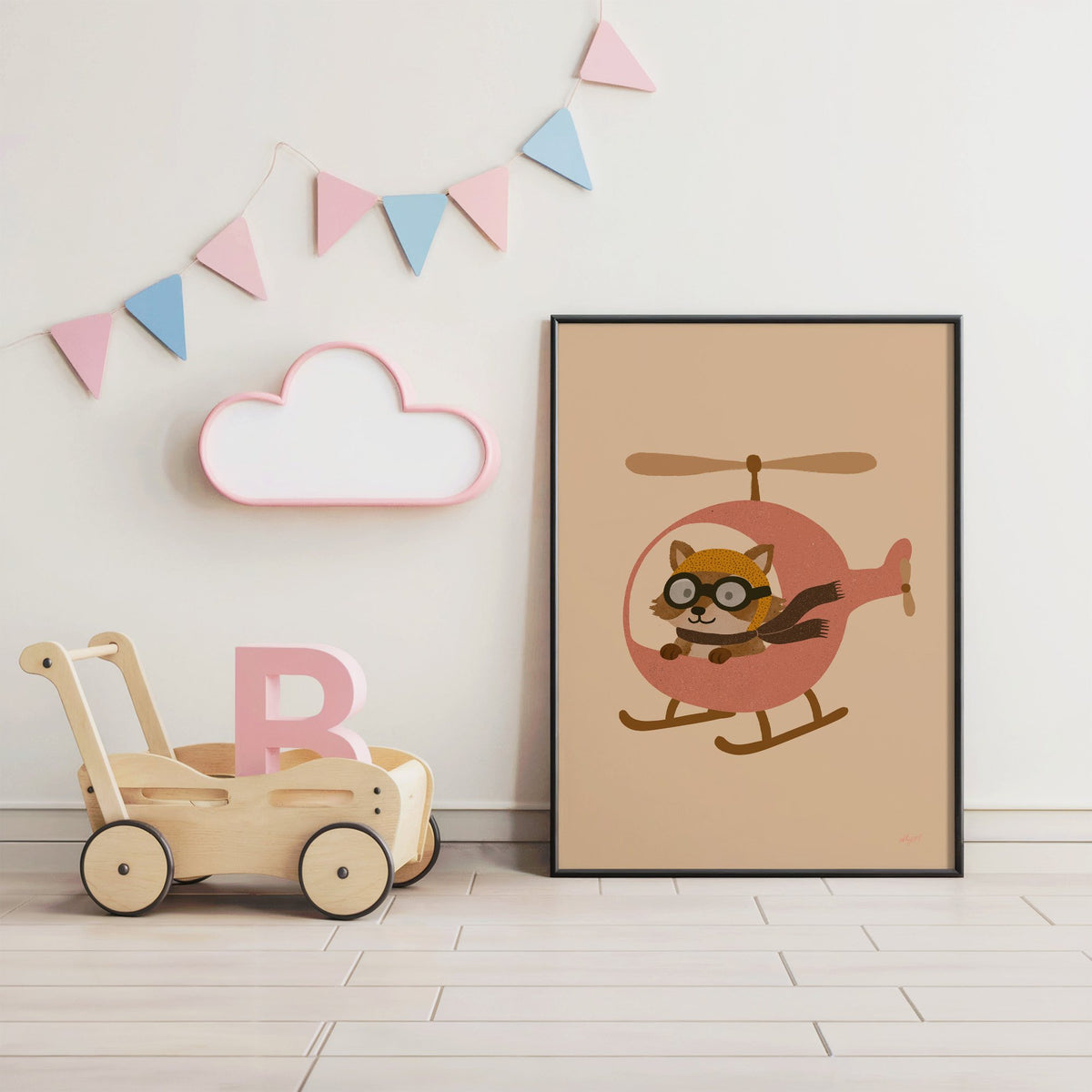 Raccoon pilot in pink helicopter nursery print in a black frame under pastel bunting by a wooden baby walker