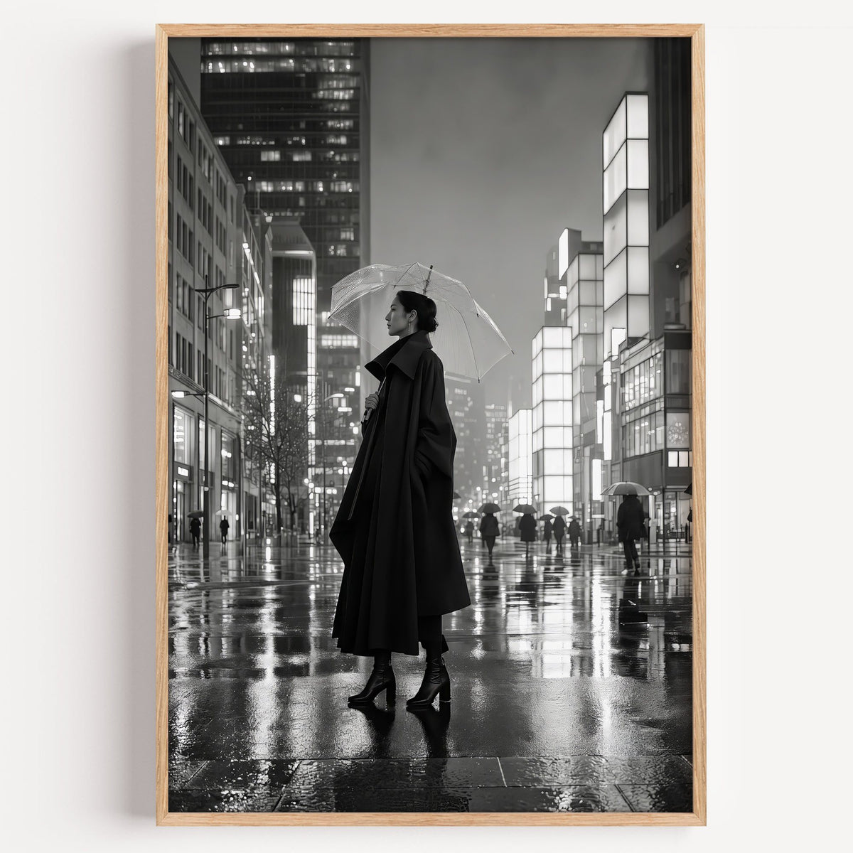Woman with clear umbrella on rainy night street print in a light oak frame on a plain white wall