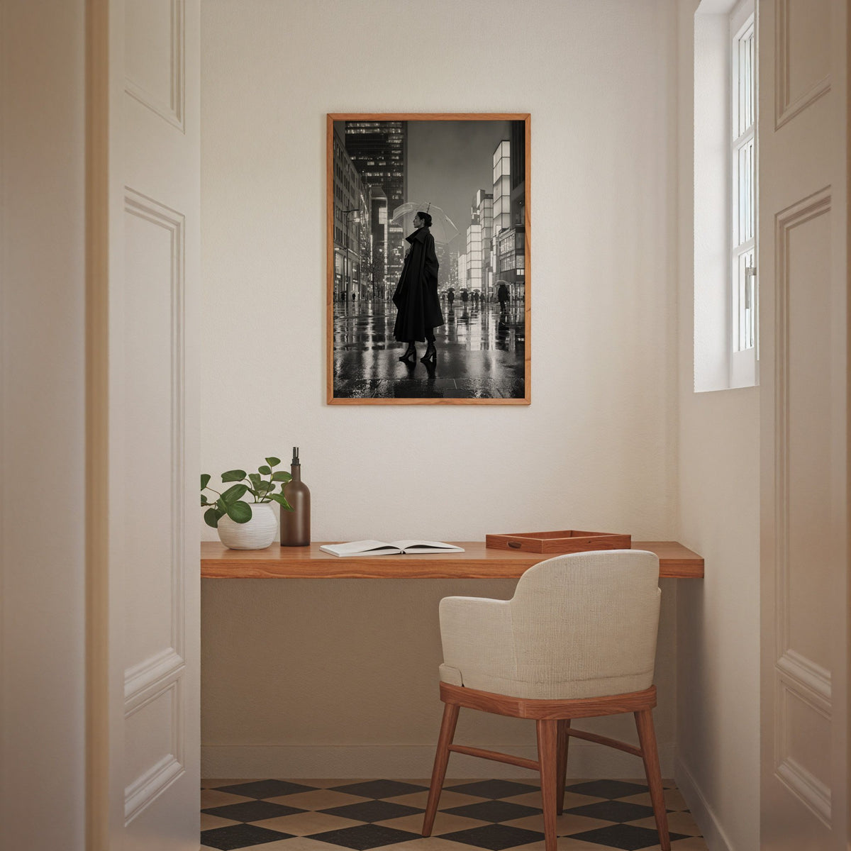 Woman with clear umbrella on rainy night street print in an oak frame above a home office desk nook