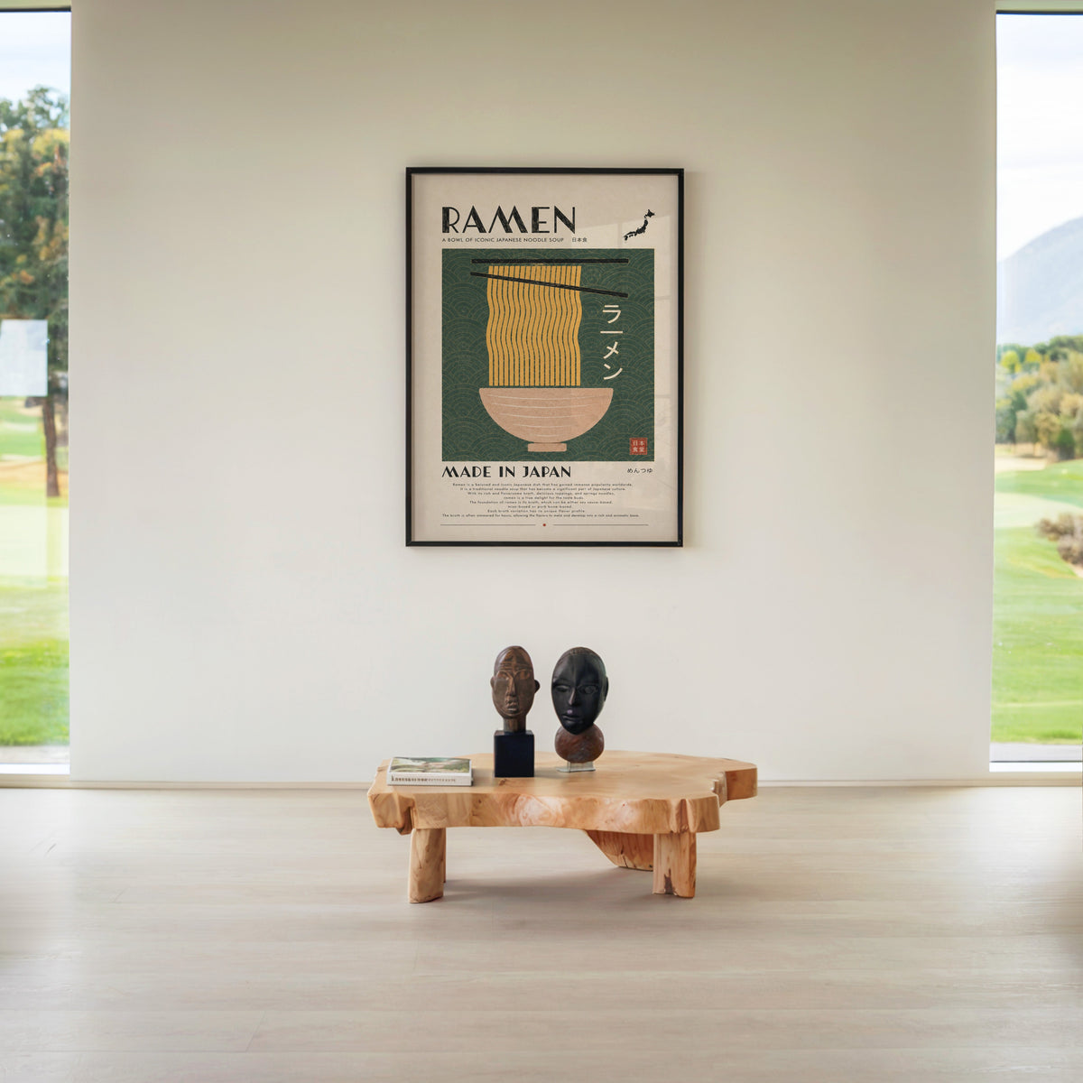 ramen noodles on green wave panel print in a black frame above a live-edge wood coffee table between garden windows